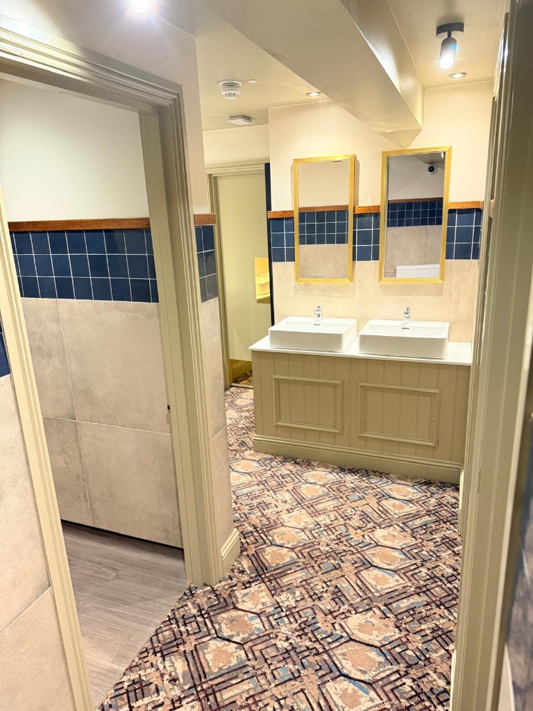 Completed — bar service area with refrigerators and neon